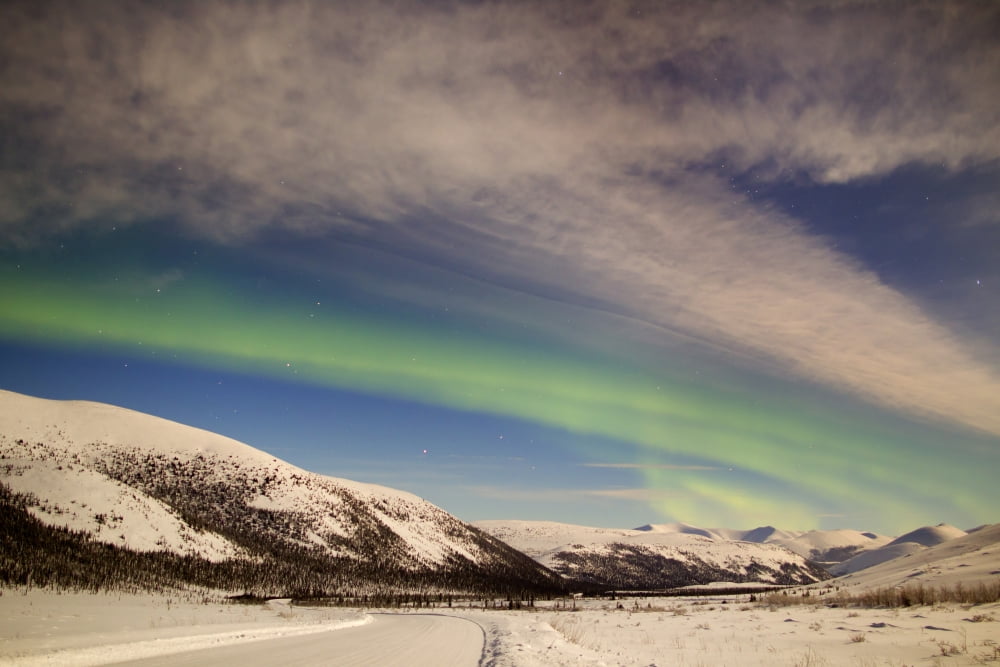Aurora borealis with moonlight over Ogilvie Mountains Canada Canvas Art - Joseph BradleyStocktrek Images (35 x 23)