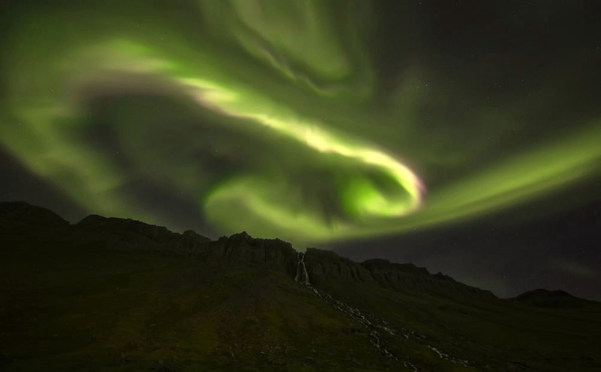 Aurora overtop of an unnamed waterfall near the town of Djupavik West Fjords Iceland Canvas Art - Robert Postma Design Pics (38 x 24)