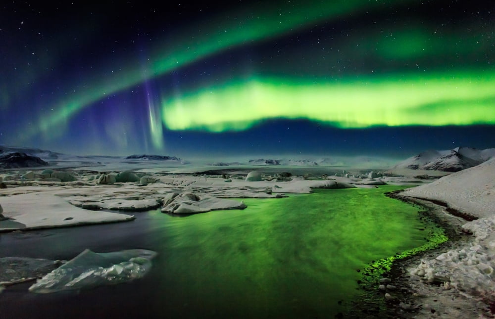Auroras and Icebergs at the glacial lagoon Jokulsarlon Breidamerkurjokull Vatnajokull Ice Cap Iceland Canvas Art - Panoramic Images (36 x 24)