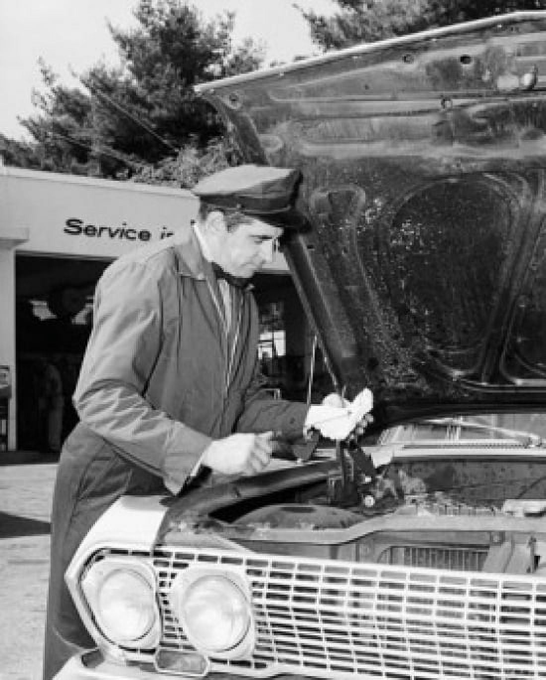 Auto mechanic repairing a car at a service station Canvas Art - (18 x 24)