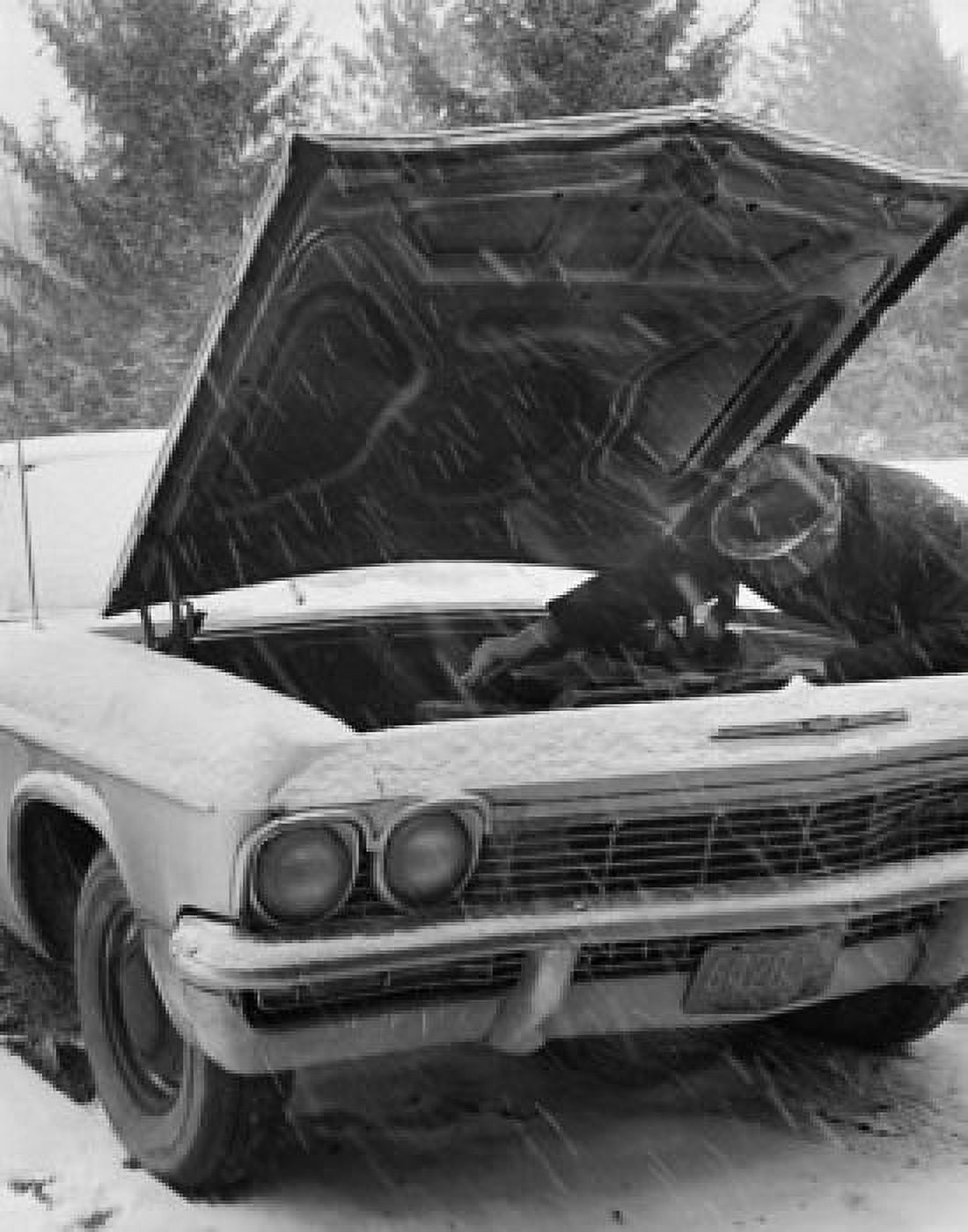 Auto mechanic repairing a vintage car Canvas Art - (24 x 36)