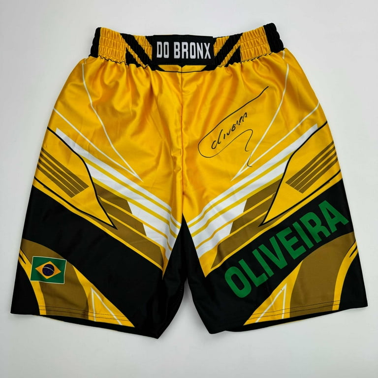 Autographed/Signed Charles Oliveira Yellow Brazil UFC MMA Trunks