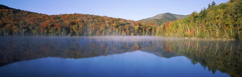 Autumn trees reflected in Heart Lake Adirondack State Park New York State USA Canvas Art - Panoramic Images (6 x 18)
