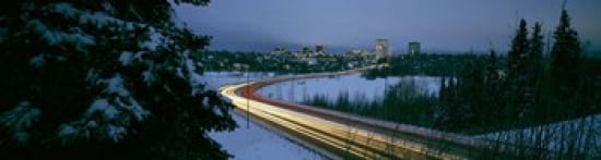 Autumobile lights on busy street distant city lights frozen Westchester Lagoon Anchorage Alaska USA Canvas Art - Panoramic Images (42 x 12)