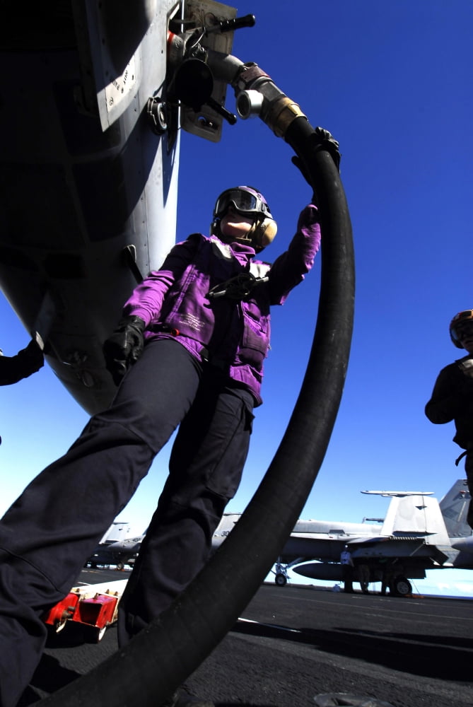 Aviation Boatswains Mate Airman fuels an aircraft Canvas Art - Stocktrek Images (23 x 34)