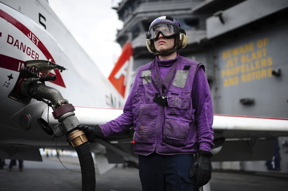 Aviation Boatswains Mate fuels a T-45C Goshawk training aircraft Canvas Art - Stocktrek Images (35 x 23)