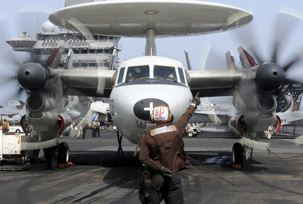 Aviation Electronics Technician directs an E-2C Hawkeye to start its engines Canvas Art - Stocktrek Images (34 x 23)