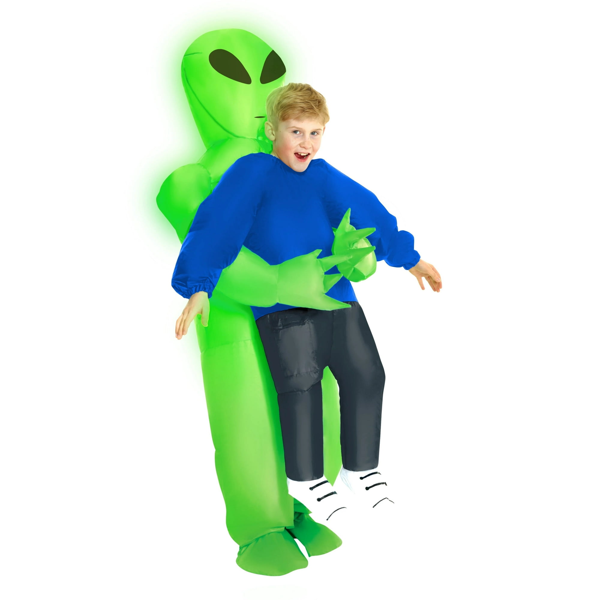 A boy in a green inflatable alien costume