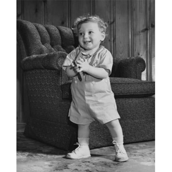 Baby Boy Standing & Holding a Picture Frame Poster Print - 18 x 24 in.