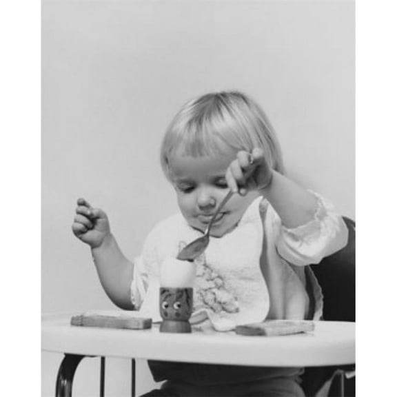 Baby Sitting in a High Chair & Eating an Egg Poster Print - 18 x 24 in.