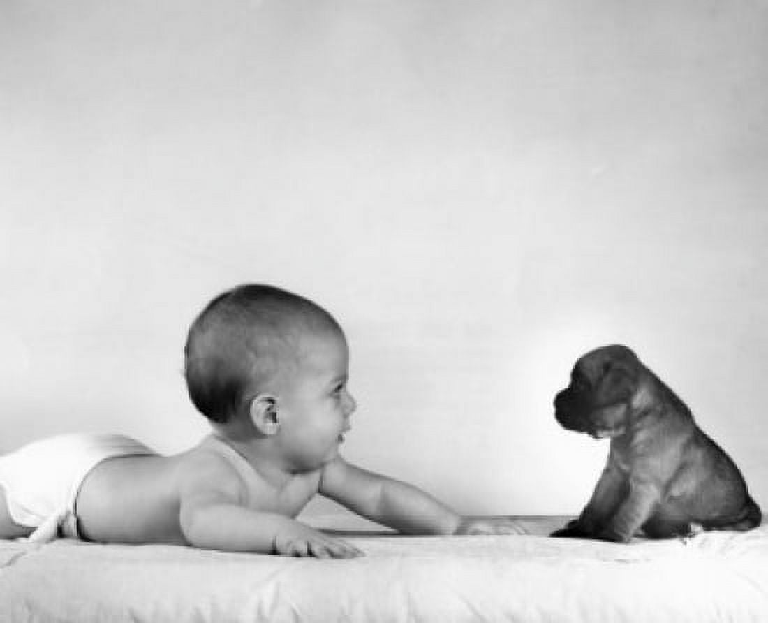 Baby and puppy lying on bed Canvas Art - (18 x 24)