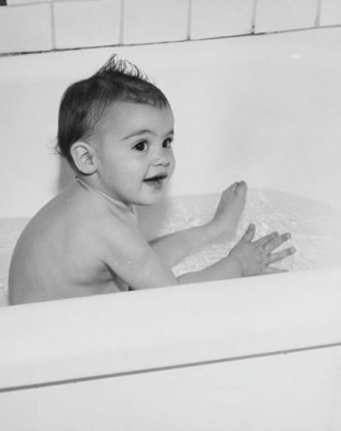 Baby bathing in a bathtub Canvas Art - (18 x 24)