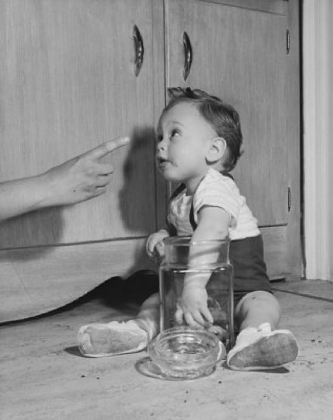 Baby boy caught with his hand in a cookie jar by his mother Canvas Art - (18 x 24)