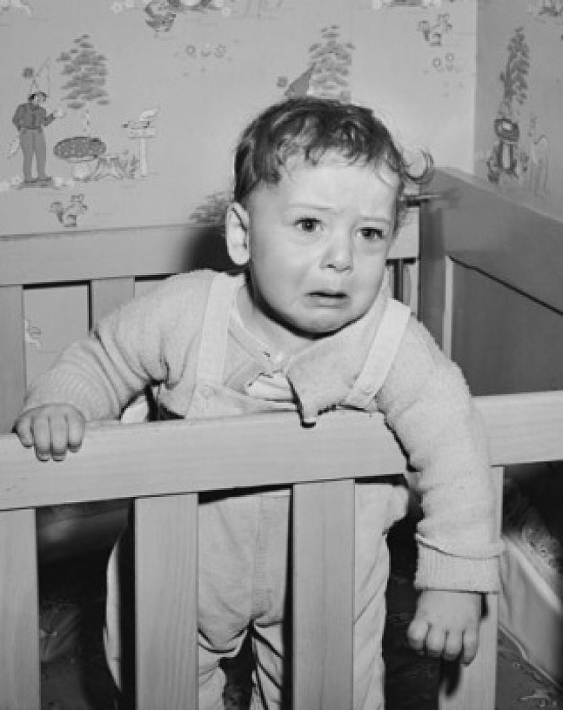 Baby boy crying in a crib Canvas Art - (24 x 36)