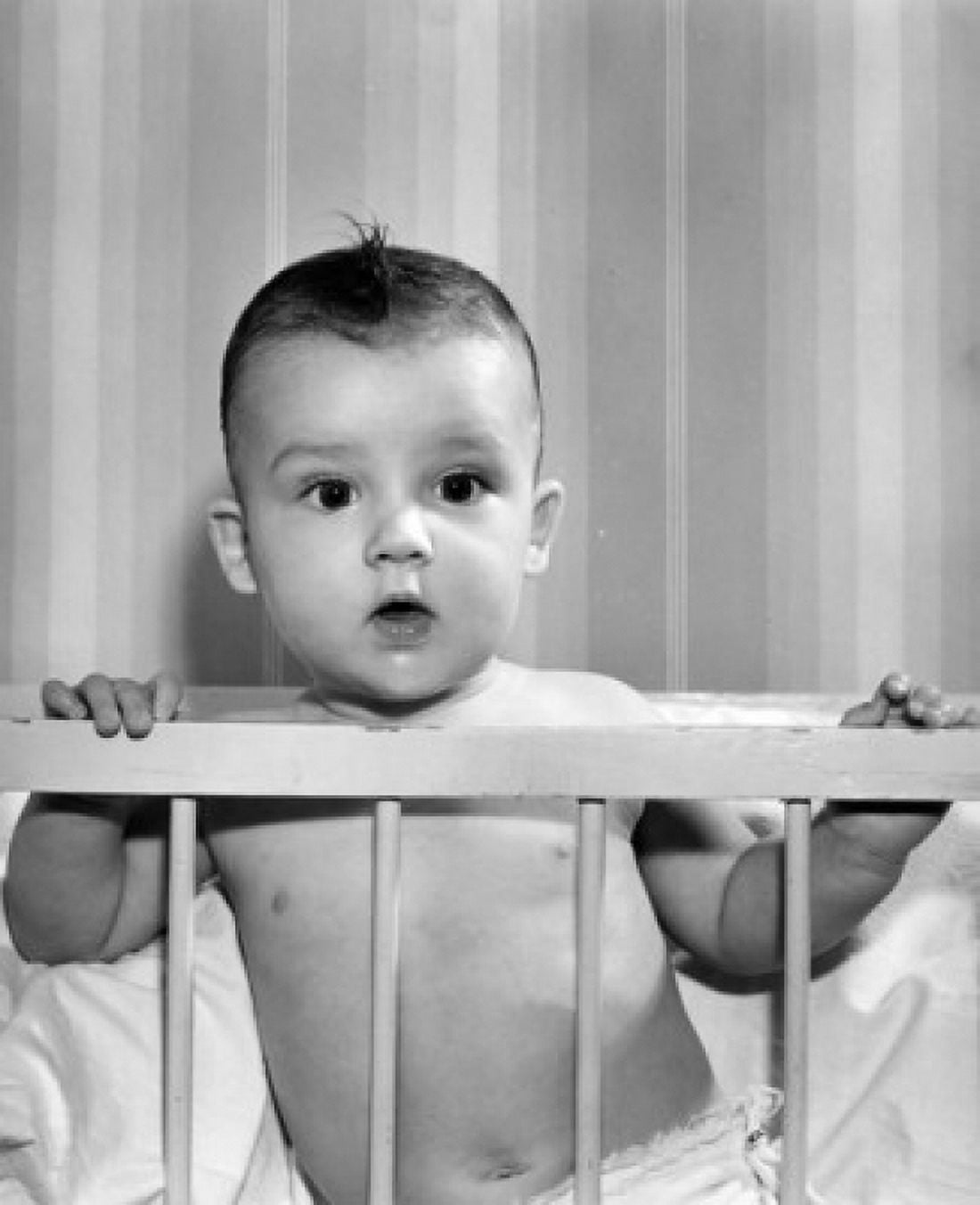 Baby boy in baby bed Canvas Art - (18 x 24)