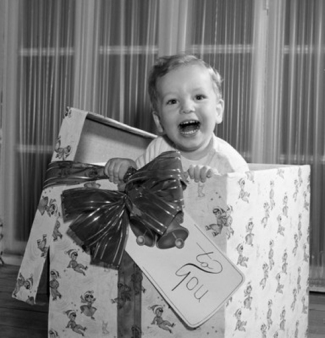 Baby boy popping out of present box Canvas Art -  (18 x 24)