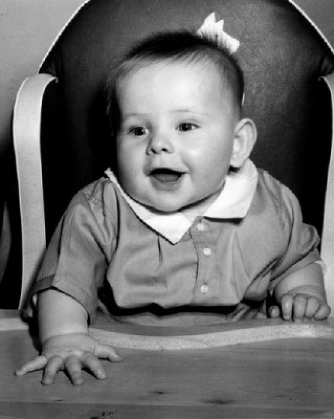 Baby boy sitting in high chair smiling Canvas Art - (18 x 24)