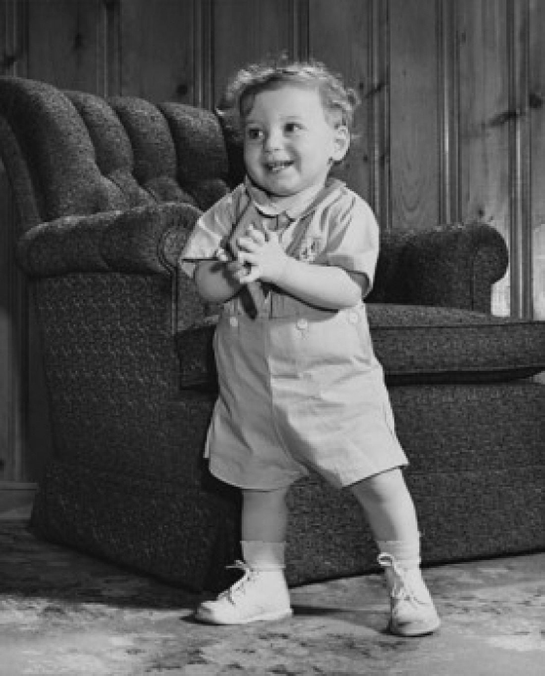 Baby boy standing and holding a picture frame Canvas Art - (24 x 36)