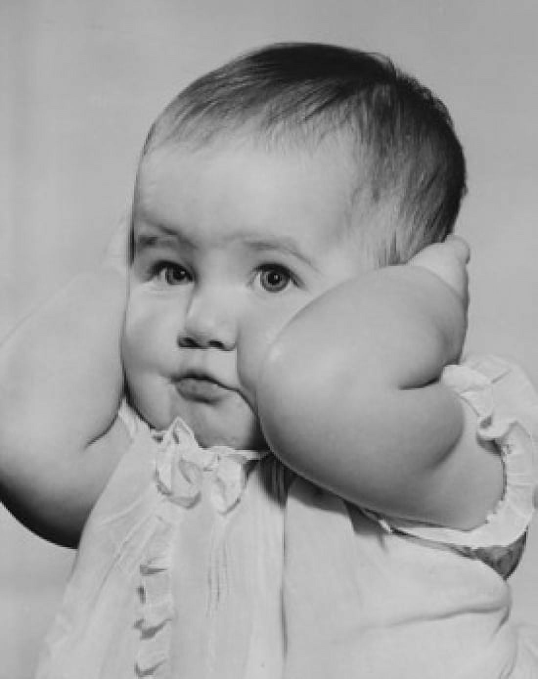Baby girl covering ears with hands Canvas Art - (18 x 24)