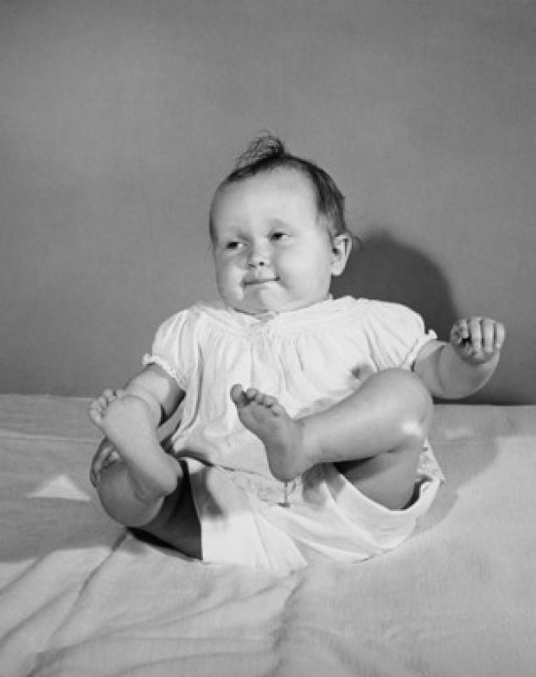 Baby girl sitting on a blanket Canvas Art - (18 x 24)