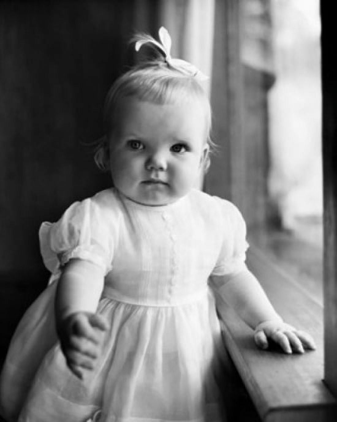 Baby girl standing near a window Canvas Art - (18 x 24)