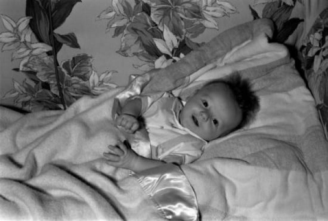 Baby lying in bed Canvas Art - (18 x 24)