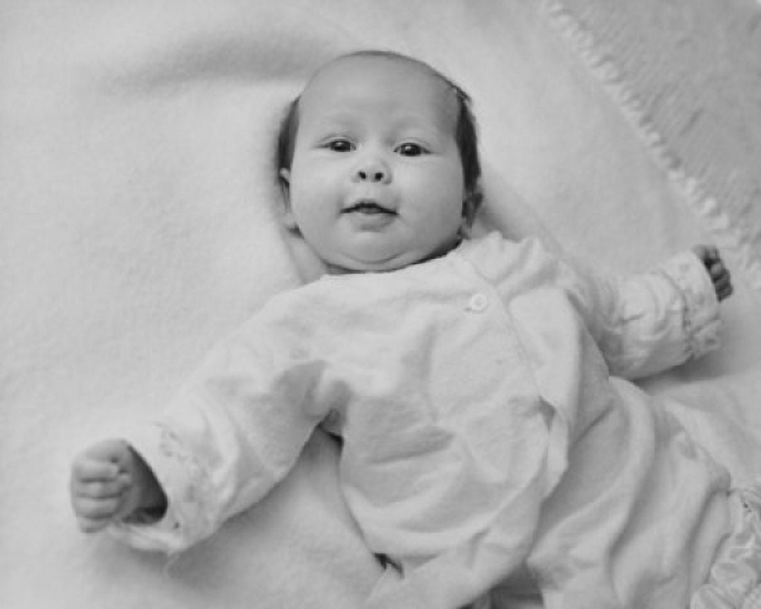 Baby lying on a blanket and smiling Canvas Art - (24 x 36)
