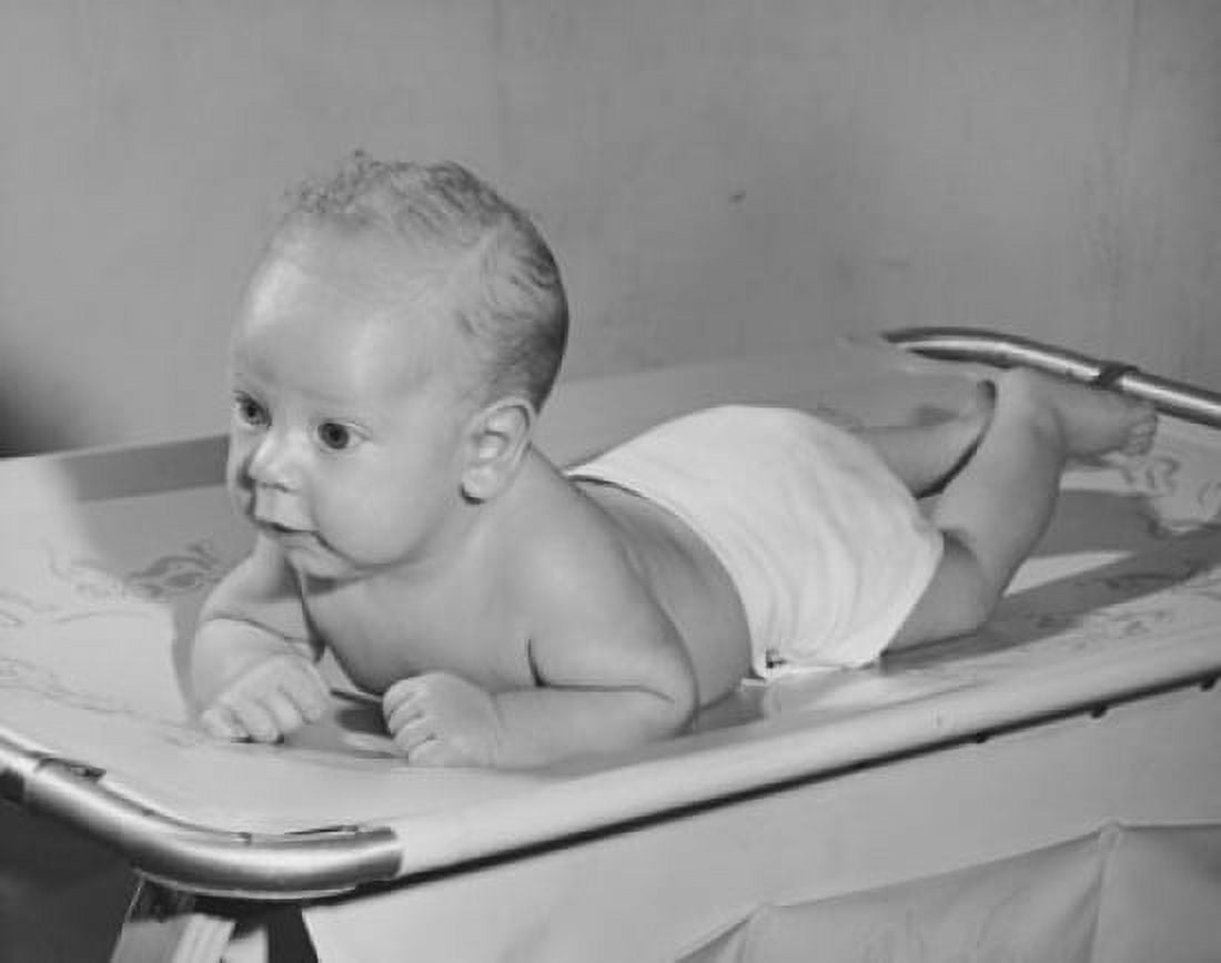 Baby lying on a weighing scale Canvas Art - (18 x 24)