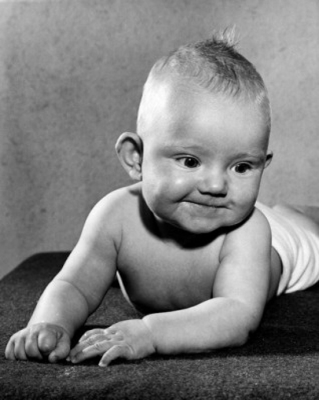 Baby lying on front Canvas Art - (18 x 24)