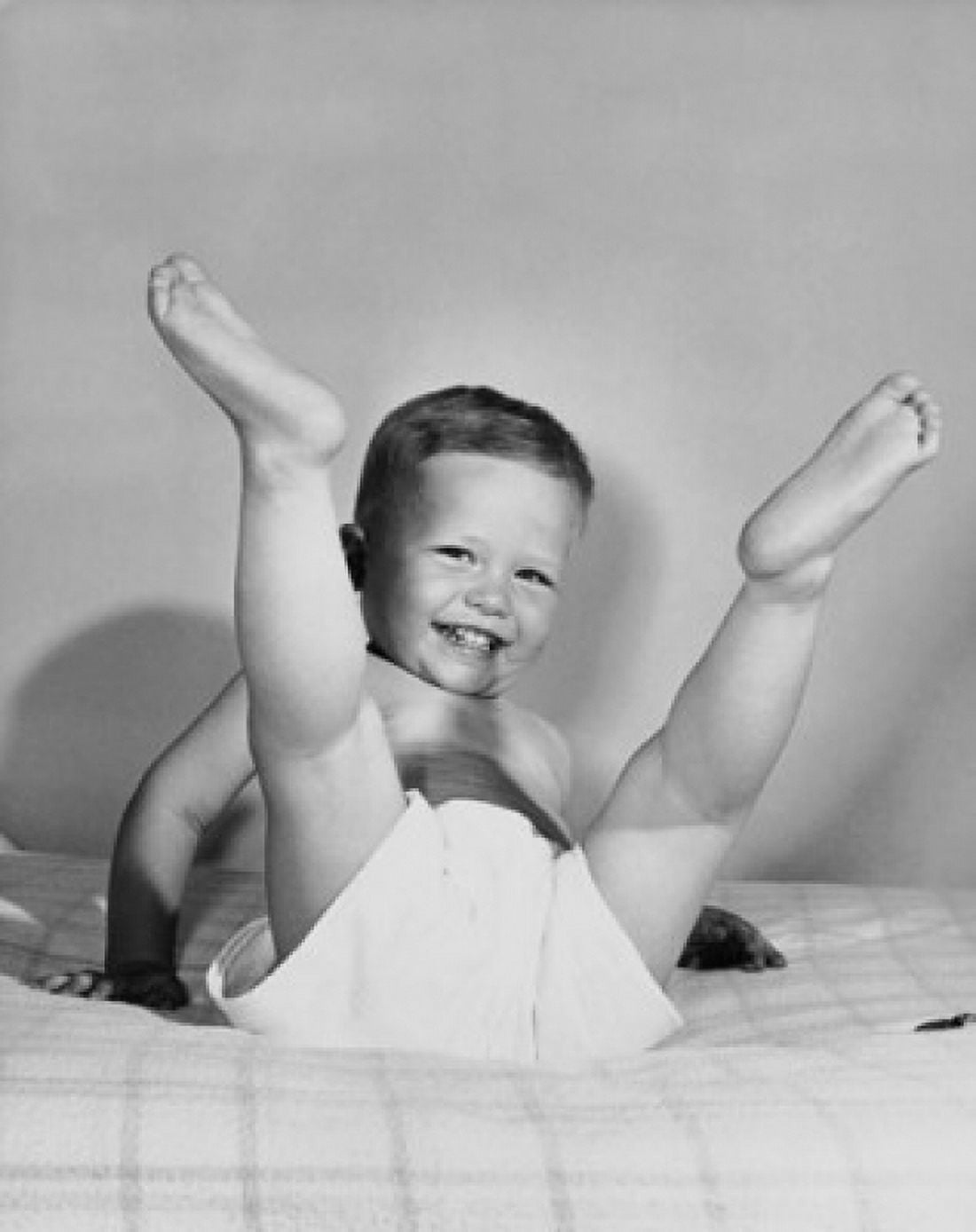 Baby playing on the bed Canvas Art - (18 x 24)