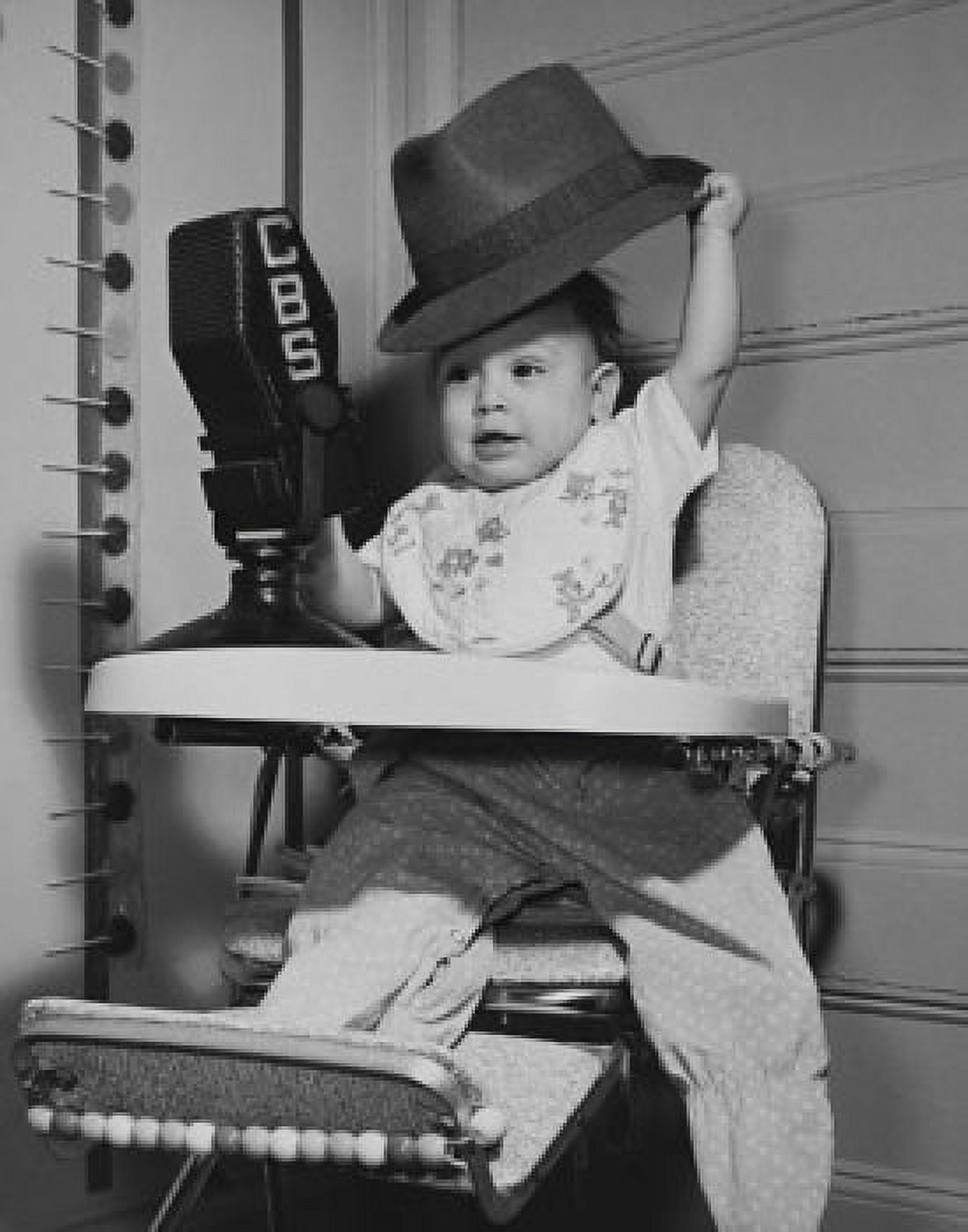 Baby sitting in a high chair Canvas Art - (24 x 36)