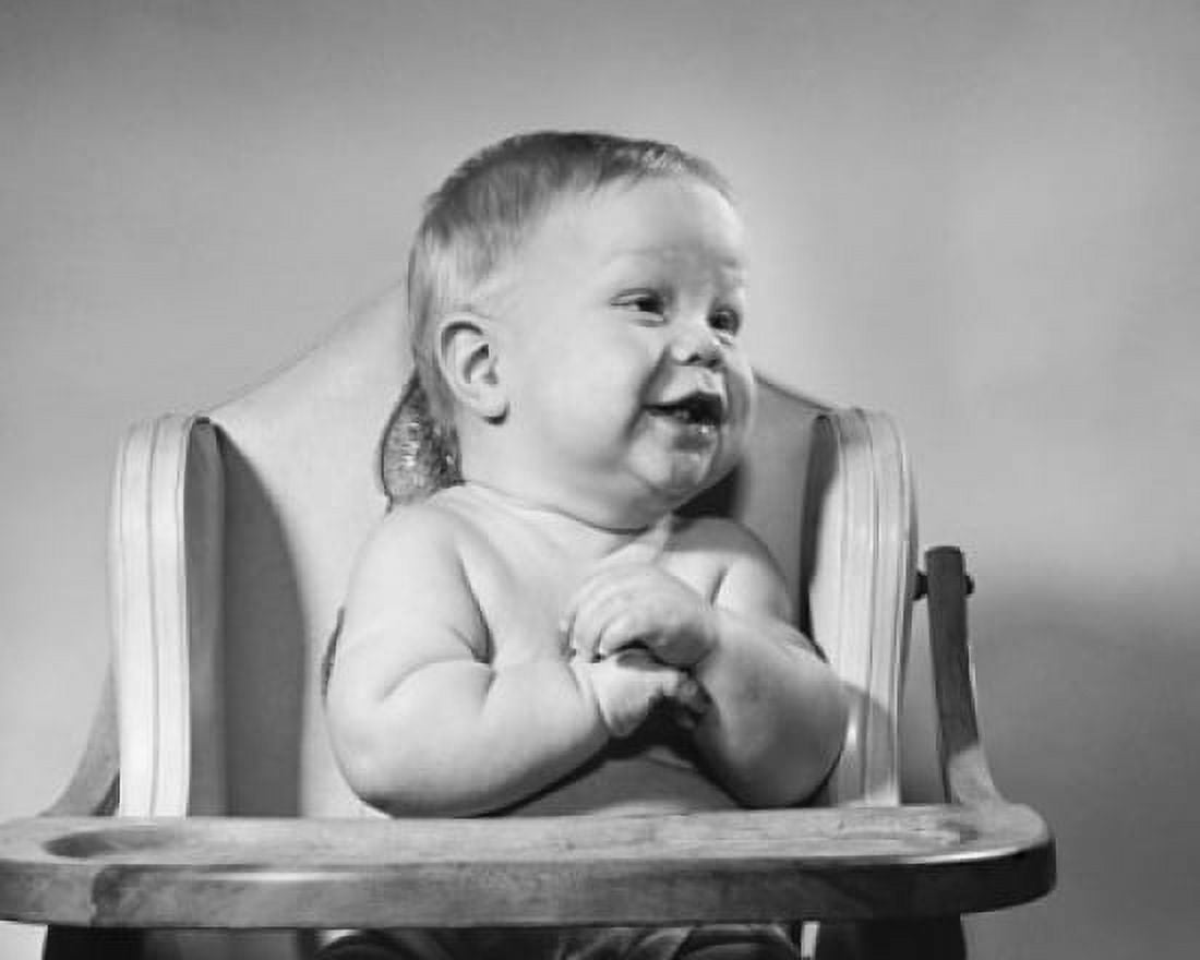 Baby sitting in a high chair and smiling Canvas Art - (18 x 24)