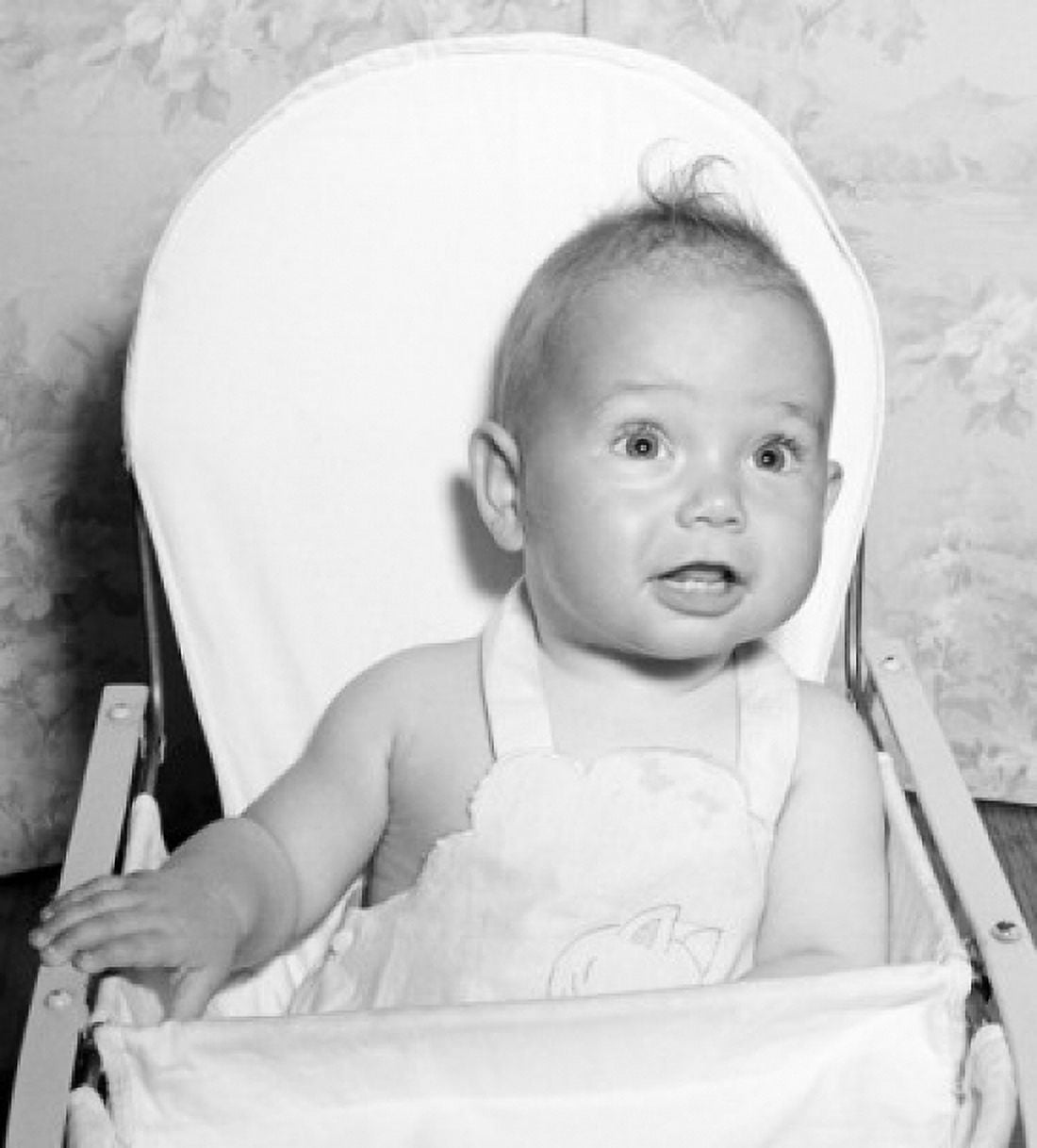 Baby sitting in high chair Canvas Art - (24 x 36)