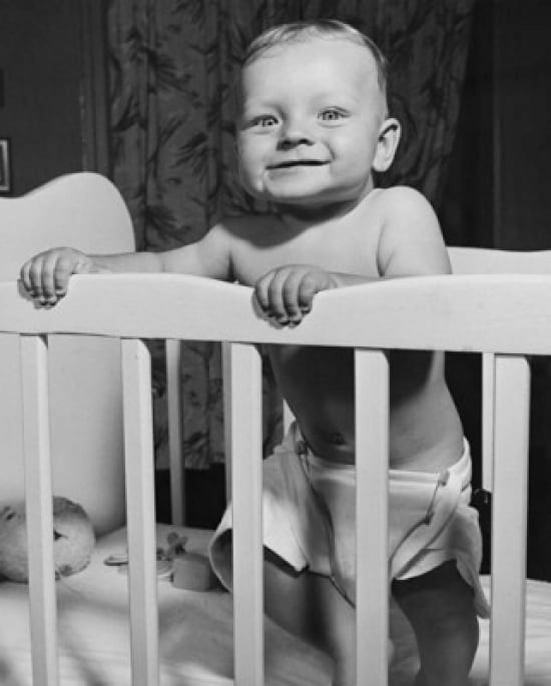 Baby standing in a crib Canvas Art - (18 x 24)
