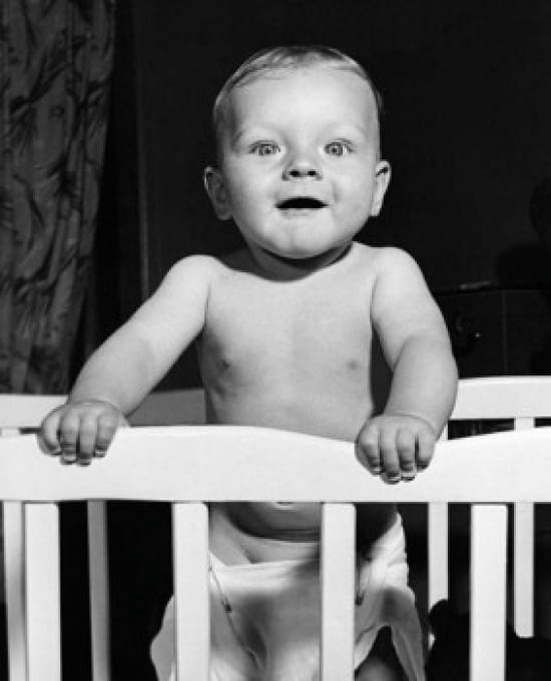 Baby standing in a crib Canvas Art - (18 x 24)