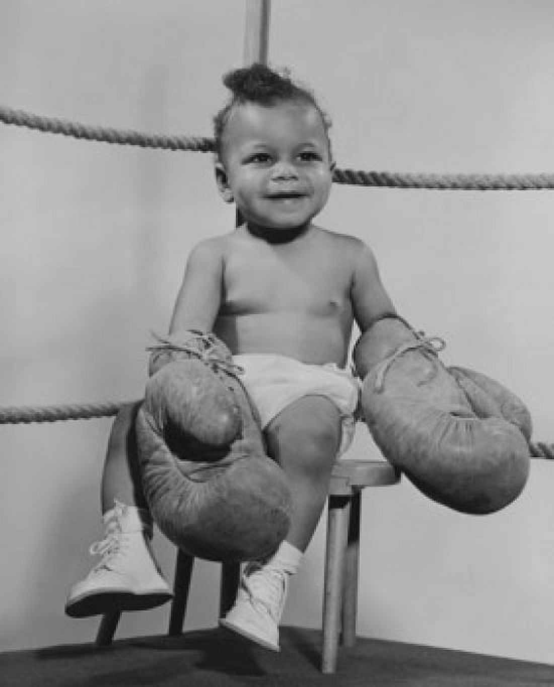 Baby wearing boxing gloves and sitting on stool in boxing ring Canvas Art - (18 x 24)