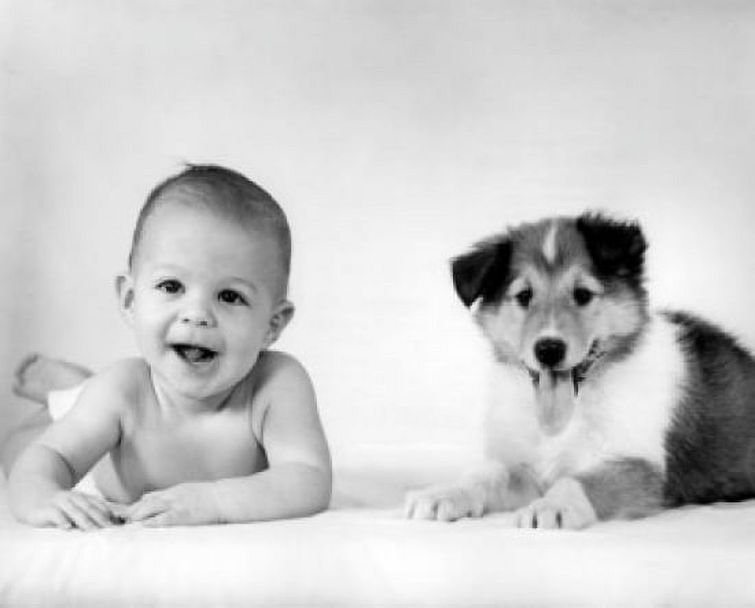 Baby with dog lying on bed Canvas Art - (18 x 24)