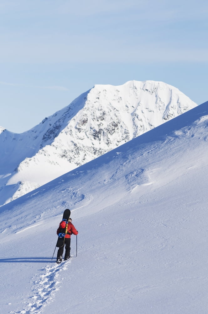 Backcountry Snowboarder Hiking Through The Snow Towards A Mountain Peak Eagle Glacier Chugach Mountains Southcentral Alaska Canvas Art - Dan Bailey Design Pics (12 x 19)