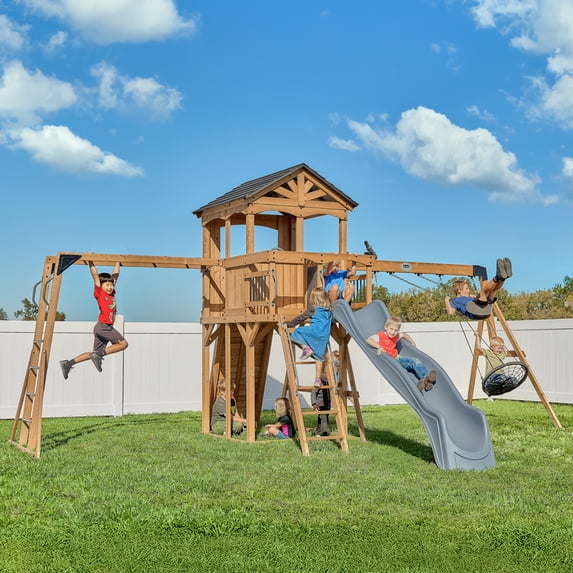 Backyard Discovery Dover Bay Spruce Swing Set with Slide, Clubhouse, Monkey Bars, and Rock Wall in brown