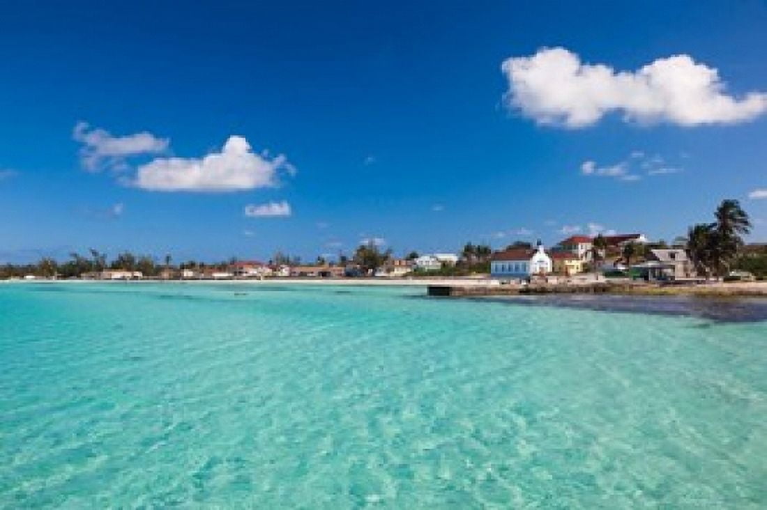 Bahamas Eleuthera Island Tarpum Bay town beach Canvas Art - Walter Bibikow DanitaDelimont (37 x 25)