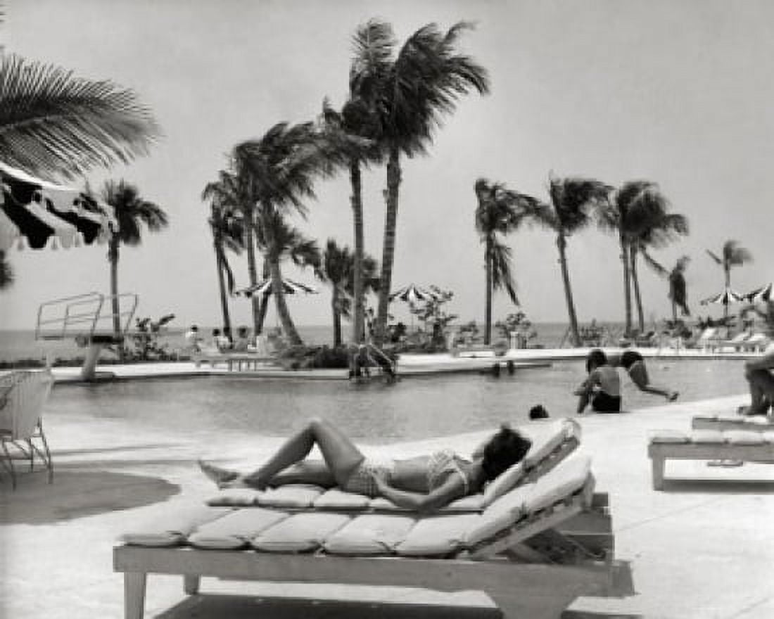 Bahamas young woman lying on lounge chair at poolside Canvas Art - (18 x 24)