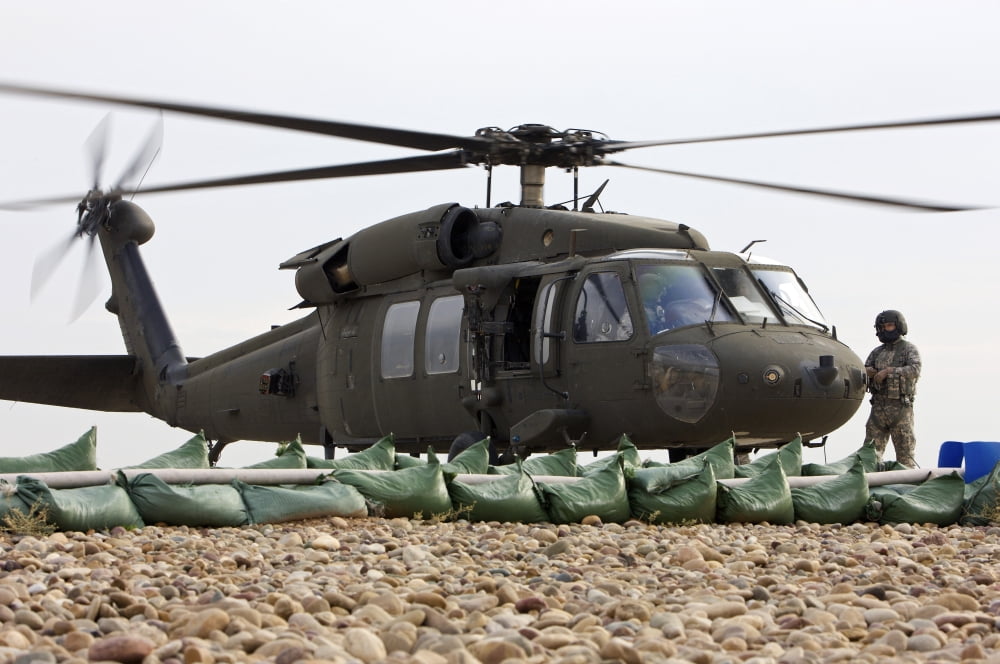 Balad Iraq - A UH-60L Black Hawk lands at the Forward Arming and Refueling Point to refuel Canvas Art - Terry MooreStocktrek Images (18 x 12)
