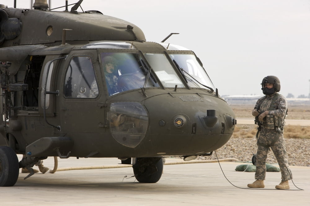Balad Iraq - A UH-60L Black Hawk lands at the Forward Arming and Refueling Point to refuel Canvas Art - Terry MooreStocktrek Images (35 x 23)