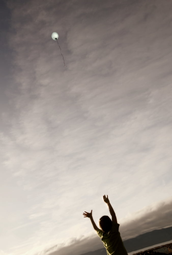 Balloon Floating Away In The Sky Canvas Art - Con Tanasiuk Design Pics (22 x 34)