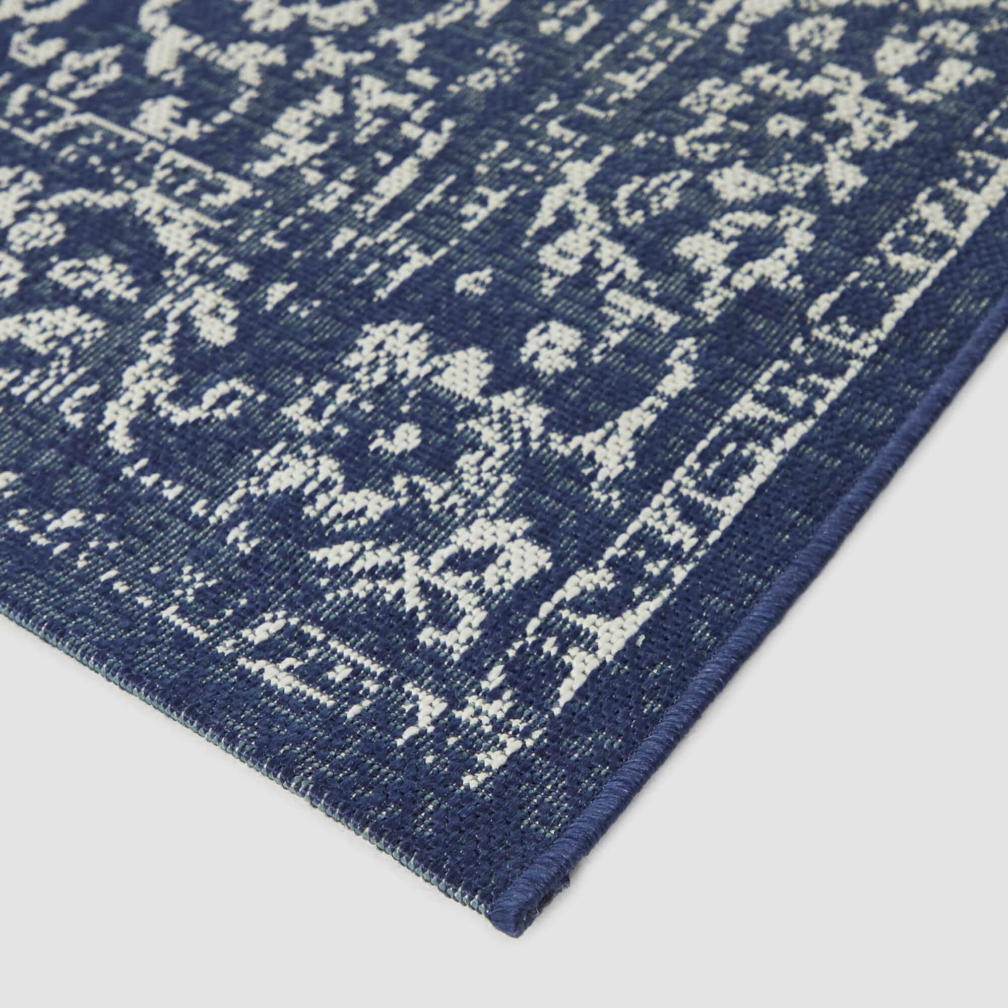 Blue and White Synthetic Oriental 8' x 10' Area Rug