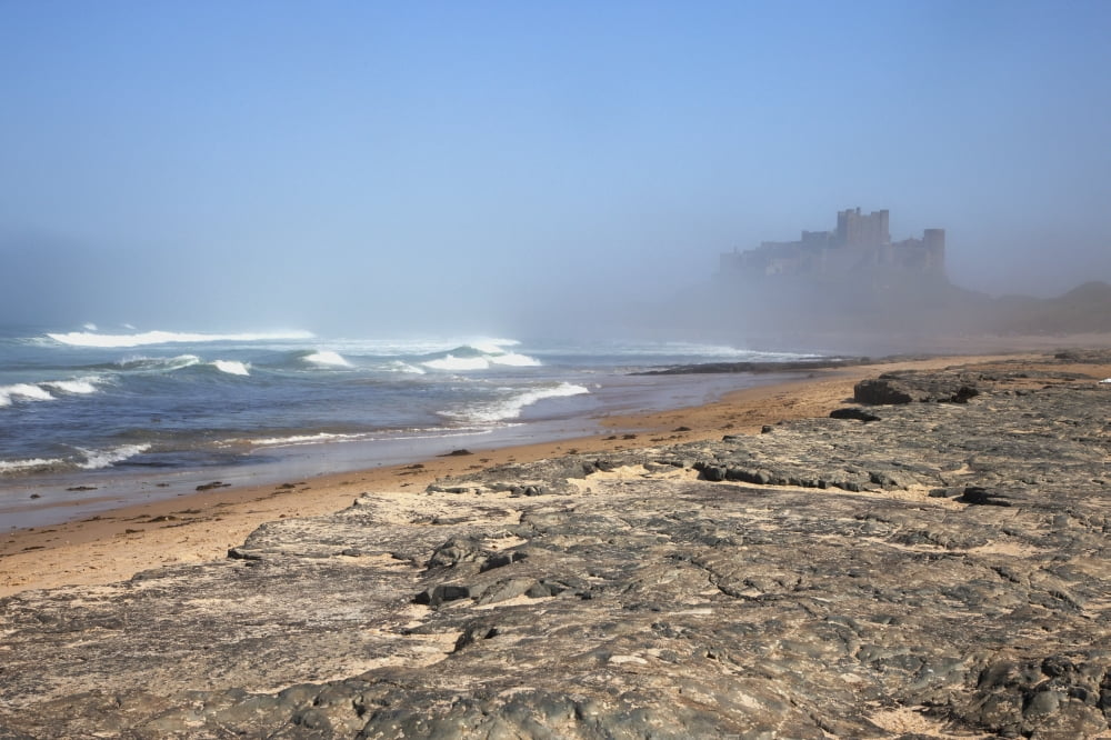 Bamburgh Castle In The Fog Bamburgh Northumberland England Canvas Art - John Short Design Pics (38 x 24)