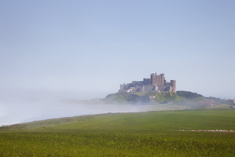 Bamburgh Castle On A Hill In The Fog Northumberland England Canvas Art - John Short Design Pics (38 x 24)
