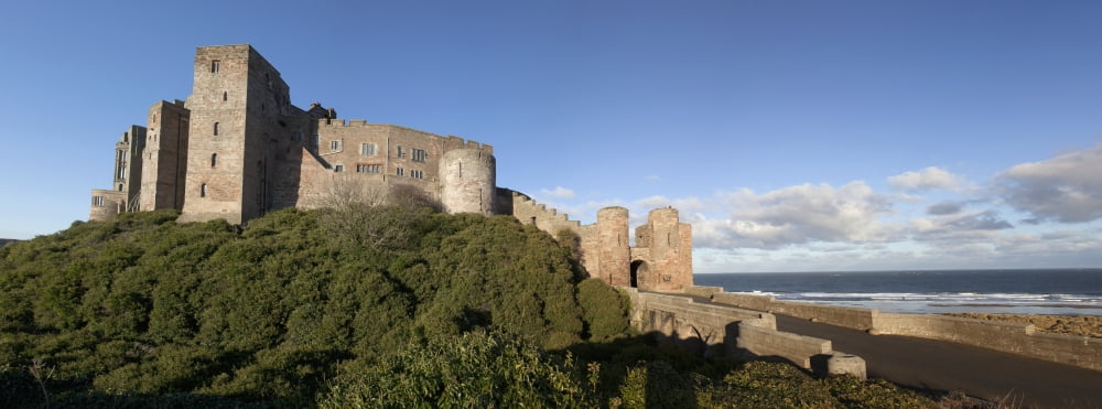 Bamburgh Castle Ruins Against A Blue Sky Bamburgh Northumberland England Canvas Art - John Short Design Pics (35 x 13)