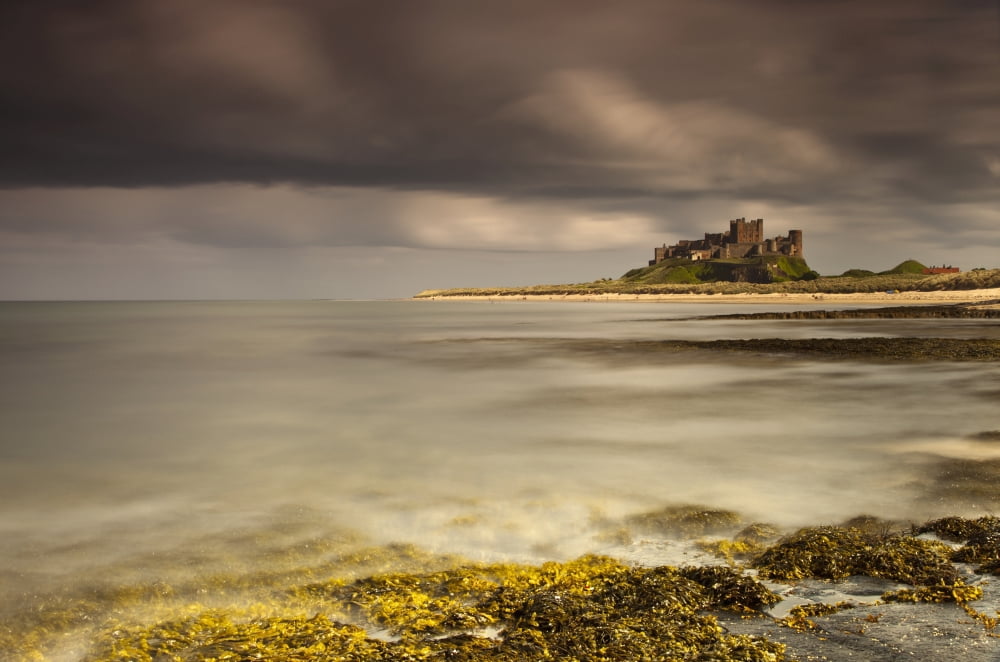 Bamburgh Castle Under A Cloudy Sky Bamburgh Northumberland England Canvas Art - John Short Design Pics (19 x 12)