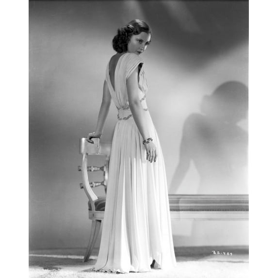 Barbara Stanwyck Showing Her Back in Long White Gown Photo Print (24 x 30)
